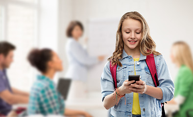 Image showing teen student girl with school bag and smartphone