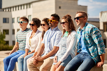 Image showing happy friends in sunglasses at city in summer