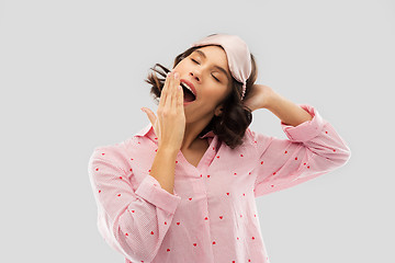 Image showing happy young woman in pajama and eye sleeping mask