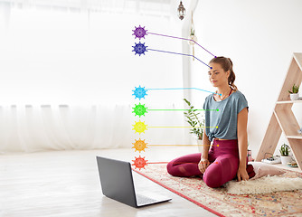 Image showing woman with laptop computer at yoga studio