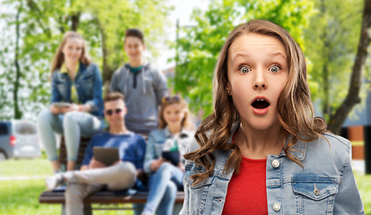 Image showing surprised or shocked teenage girl over friends