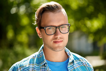 Image showing portrait of young man in glasses outdoor in summer