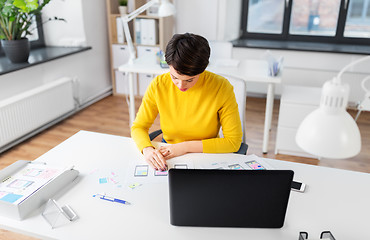 Image showing ui designer working on user interface at office