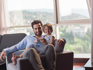 Image showing girl and her handsome father using a digital tablet