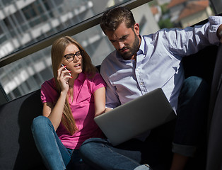 Image showing couple relaxing at  home using laptop computer