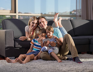 Image showing happy young couple spending time with kids