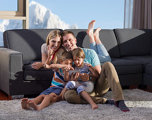 Image showing happy young couple spending time with kids