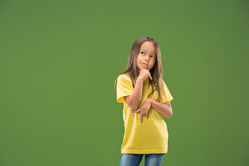 Image showing Young serious thoughtful teen girl. Doubt concept.