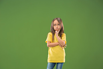 Image showing Young serious thoughtful teen girl. Doubt concept.