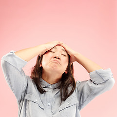 Image showing Beautiful woman looking suprised and bewildered isolated on pink