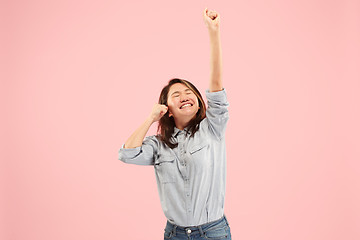 Image showing Winning success woman happy ecstatic celebrating being a winner. Dynamic energetic image of female model