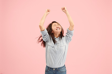 Image showing Winning success woman happy ecstatic celebrating being a winner. Dynamic energetic image of female model