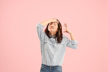 Image showing Beautiful woman looking suprised and bewildered isolated on pink