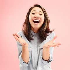 Image showing Beautiful woman looking suprised isolated on pink