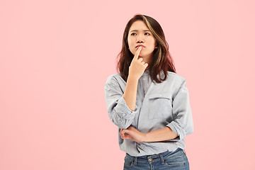 Image showing Young serious thoughtful business woman. Doubt concept.