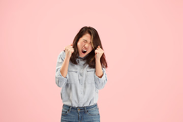 Image showing Beautiful woman looking suprised and bewildered isolated on pink