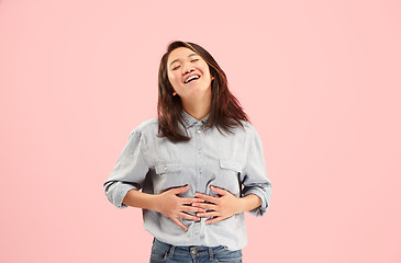 Image showing Beautiful woman looking suprised isolated on pink