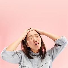 Image showing Beautiful woman looking suprised and bewildered isolated on pink