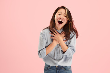 Image showing Beautiful woman looking suprised isolated on pink