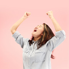 Image showing Winning success woman happy ecstatic celebrating being a winner. Dynamic energetic image of female model