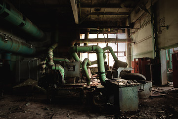 Image showing Dark industrial interior with machinery inside