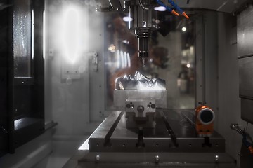 Image showing Automated robotic drill working on steel human face