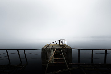 Image showing Damaged pier in the mist at morning