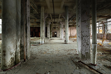 Image showing Abandoned industrial interior with large columns