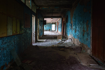 Image showing Abandoned corridor in damaged building angle shot