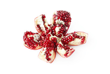 Image showing Cut pomegranate fruit on white background