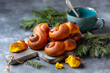 Image showing Homemade Swedish buns with saffron and raisins.