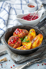 Image showing Minced meat cutlets with baked potatoes.