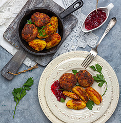 Image showing Homemade meat cutlets and baked potatoes.