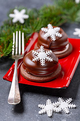 Image showing Mini chocolate cakes with Christmas decorations.