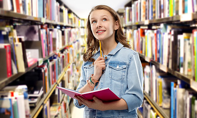 Image showing student girl with diary or notebook at library