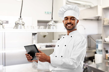 Image showing indian chef with tablet pc at restaurant kitchen