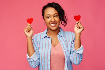 Image showing happy african american woman with red hearts