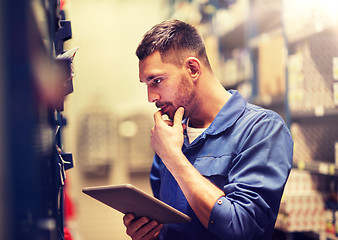 Image showing auto mechanic or smith with tablet pc at workshop