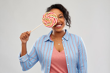 Image showing happy african american woman with big lollipop