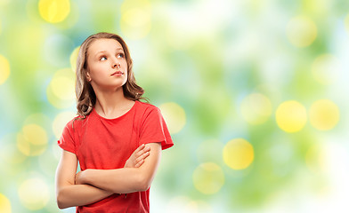 Image showing teenage girl in red t-shirt with crossed arms