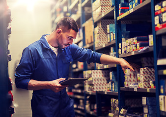 Image showing auto mechanic or smith with tablet pc at workshop