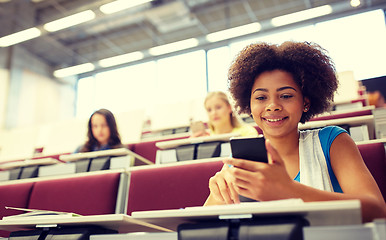 Image showing african student girl with smartphone at lecture