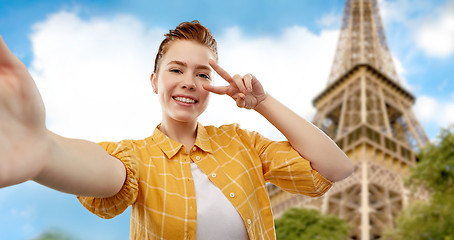 Image showing teenage girl taking selfie over eiffel tower