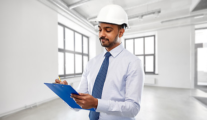Image showing architect or businessman in helmet with clipboard