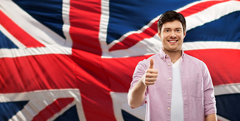 Image showing happy man showing thumbs up over british flag