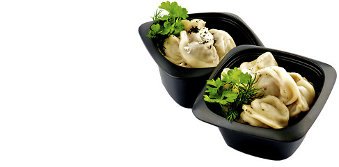 Image showing Meat Dumplings with Sour Cream and Greens