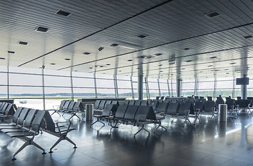 Image showing Waiting hall in the airport with empty arm-chairs.