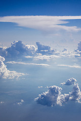 Image showing Clear blue sky with big fluffy cumulus clouds.