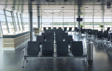 Image showing Empty waiting hall in airport with lounge area.