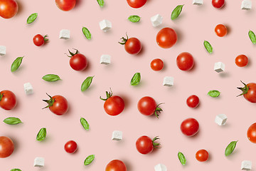 Image showing Juicy fresh organic tomatoes pattern with cheese and basil.